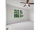 Bright bedroom featuring neutral walls, carpet, a window offering outdoor views, and ceiling fan at 3823 Vanguard Cir, Carmel, IN 46032