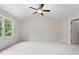 Bright, spacious bedroom with neutral carpet, ceiling fan, and ample natural light at 3823 Vanguard Cir, Carmel, IN 46032