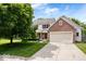 Charming two-story home featuring a brick accent, attached two-car garage, and a well-manicured front yard at 3823 Vanguard Cir, Carmel, IN 46032