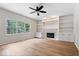 Spacious living room boasts fireplace, built-in shelves, hardwood floors, and ample natural light at 3823 Vanguard Cir, Carmel, IN 46032