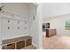 Well-organized mudroom featuring coat hooks, bench seating, and storage cubbies at 3823 Vanguard Cir, Carmel, IN 46032