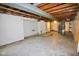 Unfinished basement featuring painted walls, exposed ductwork, and concrete floors at 3922 N Irvington Ave, Indianapolis, IN 46226
