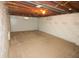 Finished basement space features neutral paint and carpet for a cozy touch at 3922 N Irvington Ave, Indianapolis, IN 46226