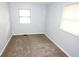 Neutral bedroom with gray walls and neutral carpeting, plus a double-hung window at 3922 N Irvington Ave, Indianapolis, IN 46226