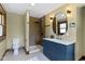 Updated bathroom featuring a vanity, walk-in shower, and modern fixtures at 4002 Guilford Ave, Indianapolis, IN 46205