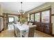 This stylish dining area flows into the living room and features large windows and a built-in buffet at 4002 Guilford Ave, Indianapolis, IN 46205