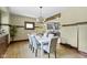 The dining room boasts seating for six, stylish lighting, and seamless access to the modern kitchen at 4002 Guilford Ave, Indianapolis, IN 46205