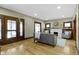 Cozy living room featuring hardwood floors, decorative fireplace, and ample seating space for relaxation at 4002 Guilford Ave, Indianapolis, IN 46205