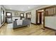 Cozy living room featuring hardwood floors, decorative fireplace, and ample seating space for relaxation at 4002 Guilford Ave, Indianapolis, IN 46205