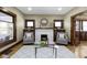 Inviting living room with a stylish fireplace, comfortable armchairs, and decorative accents creating a cozy ambiance at 4002 Guilford Ave, Indianapolis, IN 46205