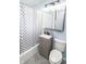 Bathroom featuring a granite vanity sink, framed mirror with lighting, and a shower and tub combo at 4020 Alden Ave, Indianapolis, IN 46221