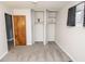 A bright bedroom features dual closets and a window with black-out drapes at 4020 Alden Ave, Indianapolis, IN 46221