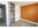 A bedroom includes open closet space and neutral walls for a modern look at 4020 Alden Ave, Indianapolis, IN 46221
