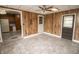 View of a dining room with a ceiling fan, access to the kitchen, and two exit doors at 4020 Alden Ave, Indianapolis, IN 46221