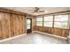 View of dining room with large windows, ceramic tile flooring, and door to the exterior at 4020 Alden Ave, Indianapolis, IN 46221
