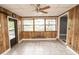 The dining room features large windows, ceramic tile flooring, and a ceiling fan at 4020 Alden Ave, Indianapolis, IN 46221