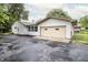 Exterior of the house features an attached garage and paved driveway at 4020 Alden Ave, Indianapolis, IN 46221