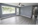 Bright living room with ceiling fan, neutral paint, and hardwood floors at 4020 Alden Ave, Indianapolis, IN 46221