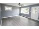 Bright living room with ceiling fan, neutral paint, and hardwood floors at 4020 Alden Ave, Indianapolis, IN 46221