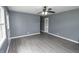 Bright living room with ceiling fan, neutral paint, and hardwood floors at 4020 Alden Ave, Indianapolis, IN 46221