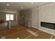 Spacious living room area features modern electric fireplace and large sun-filled windows at 4151 Barrel Ln, Westfield, IN 46062