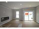 Bright living room with fireplace, large window and sliding door to deck at 4151 Barrel Ln, Westfield, IN 46062
