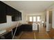 Modern kitchen featuring sleek dark cabinets, island and bright, open floorplan at 4161 Barrel Ln, Westfield, IN 46062