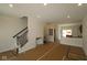 Spacious living room featuring an open layout with a staircase and new wood flooring at 4161 Barrel Ln, Westfield, IN 46062