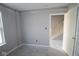 Unfinished bedroom features window and doorway to the stairway at 4171 Barrel Ln, Westfield, IN 46062