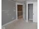 Unfinished bedroom features a closet and a doorway to a separate room at 4171 Barrel Ln, Westfield, IN 46062