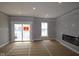 Spacious living room with a fireplace and sliding door to a balcony at 4171 Barrel Ln, Westfield, IN 46062