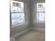 Bright bedroom featuring two large windows offering natural light and a neutral color scheme at 4181 Barrel Ln, Westfield, IN 46062