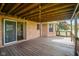 The back deck features a cozy area for relaxing or entertaining and is accessible from the house through a sliding glass door at 4287 Gibbs Rd, Danville, IN 46122