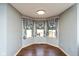Cozy breakfast nook with three windows and buffalo check valances at 4287 Gibbs Rd, Danville, IN 46122
