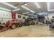 A spacious garage workshop with car lift, tools, and ample room for projects and automotive enthusiasts at 4287 Gibbs Rd, Danville, IN 46122