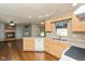 Spacious kitchen with breakfast bar and view to living room fireplace at 4287 Gibbs Rd, Danville, IN 46122