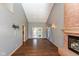 Bright, spacious living room with hardwood floors, fireplace, and a sliding door to the exterior at 4287 Gibbs Rd, Danville, IN 46122