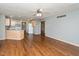 View of an open concept living area with wood flooring and a ceiling fan at 4287 Gibbs Rd, Danville, IN 46122