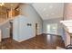 Spacious living room featuring hardwood floors, tall ceilings, fireplace, and natural light at 4287 Gibbs Rd, Danville, IN 46122
