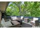 Back deck with patio furniture and tree coverage at 4570 Moccosin Pl, Greenwood, IN 46142