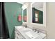 Bathroom featuring a dual sink vanity, marble countertop, and stylish fixtures at 4570 Moccosin Pl, Greenwood, IN 46142