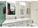 Bathroom with dual vanity, marble countertop, white cabinets, and dual mirrors at 4570 Moccosin Pl, Greenwood, IN 46142