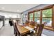 Open dining area with backyard views, seamless transition to updated kitchen with stainless appliances at 4570 Moccosin Pl, Greenwood, IN 46142