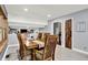 Dining room features wood floors, a wooden table, and a charming rustic door at 4570 Moccosin Pl, Greenwood, IN 46142