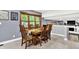 Cozy dining room with a large window for natural light and a wooden dining table at 4570 Moccosin Pl, Greenwood, IN 46142