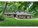 Charming two-story home features brick accents, lush landscaping and a welcoming front entrance at 4570 Moccosin Pl, Greenwood, IN 46142