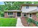 A welcoming two-story home with a walkway leading to a black, double-door front entrance at 4570 Moccosin Pl, Greenwood, IN 46142