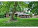Charming two-story home with lush green lawn and mature tree in a serene, neighborhood setting at 4570 Moccosin Pl, Greenwood, IN 46142