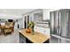 Open kitchen with stainless steel refrigerator and large center island at 4570 Moccosin Pl, Greenwood, IN 46142