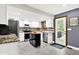Modern kitchen with white cabinets, stainless steel appliances, and center island at 4570 Moccosin Pl, Greenwood, IN 46142